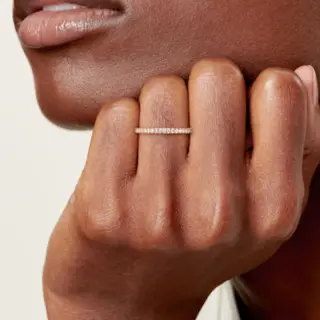 Elegant Tiffany Soleste half eternity ring in platinum with sparkling round diamonds across the top of the band