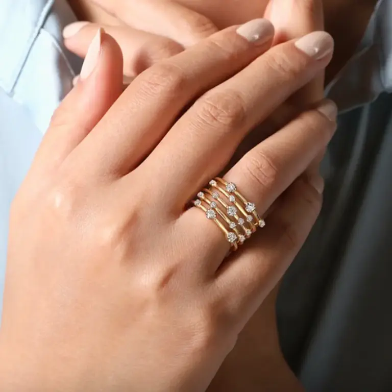 Gabriel & Co. LR52179Y45JJ ring featuring a polished gold band and varying diamond size