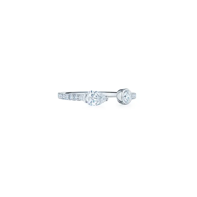 Elegant 18K white gold open band ring by Kwiat, adorned with round diamonds for a modern, minimalist look.