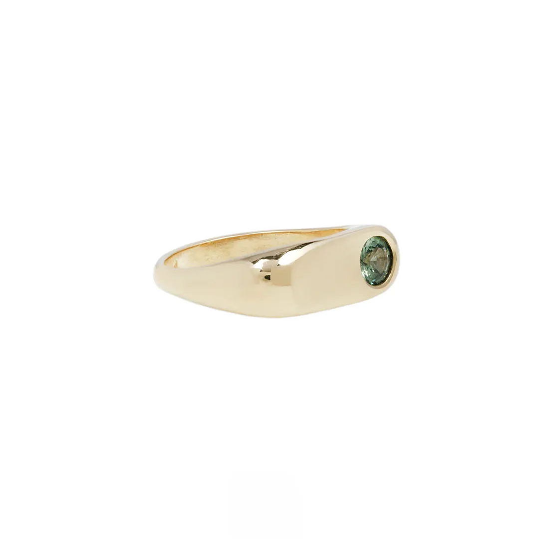 Side profile of the Indigo Emerald Ring, emphasizing the smooth 3.7mm domed band and the elegant design.
