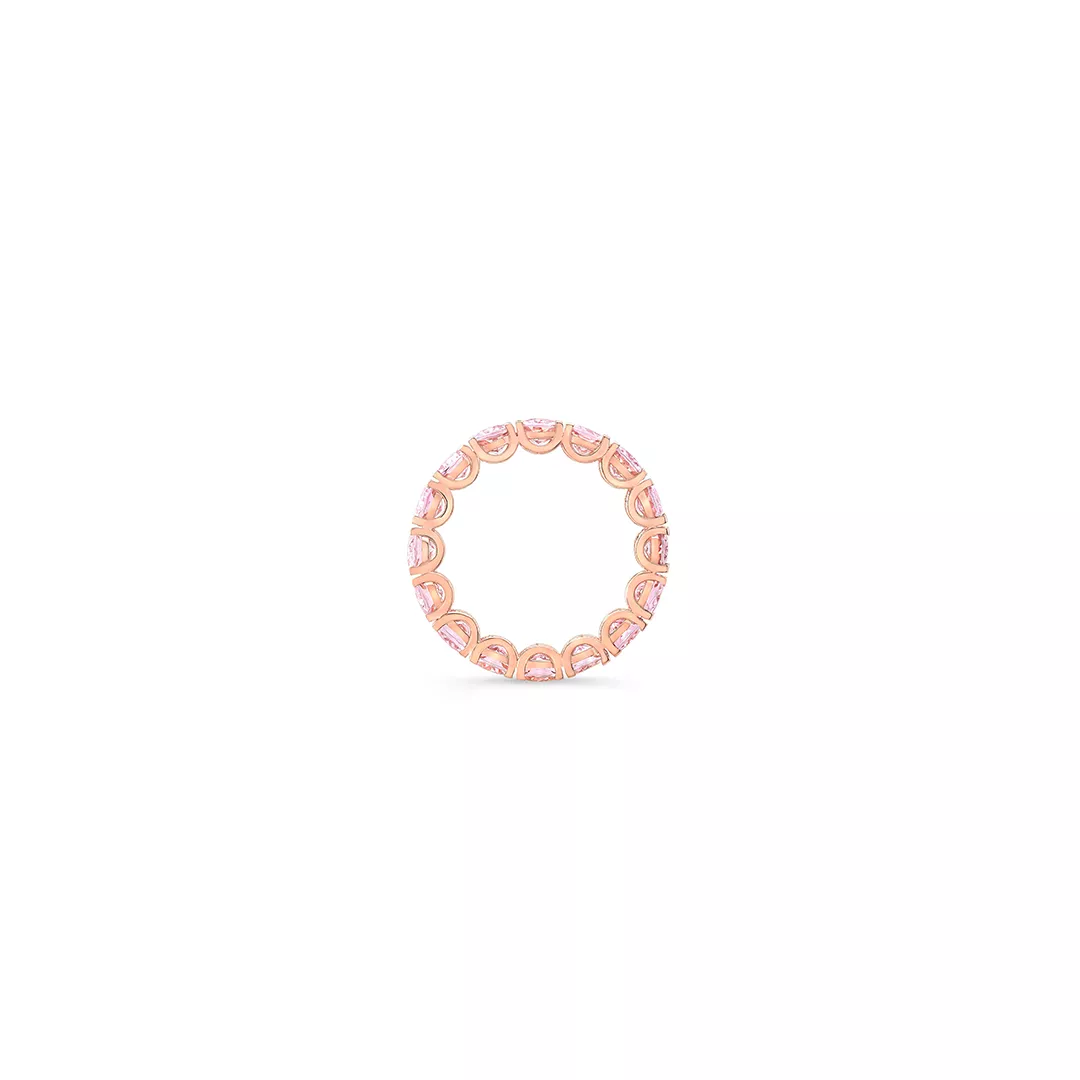 Elegant engagement ring featuring oval morganite stones in a continuous eternity band design.
