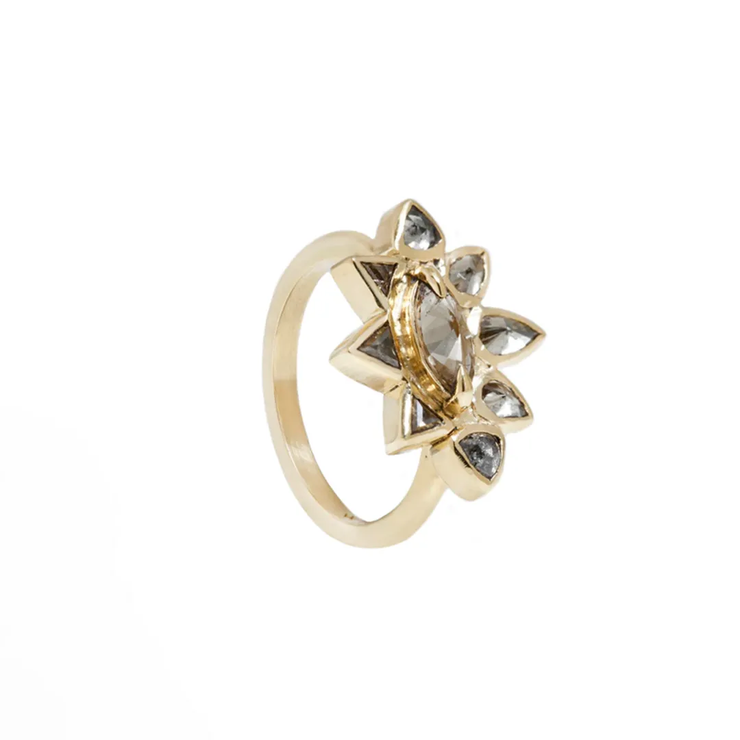 Statement Sunrise Ring in 18k yellow gold with marquise gray-green diamond and pear/trillion-cut accent diamonds by Lauren Wolf Jewelry.