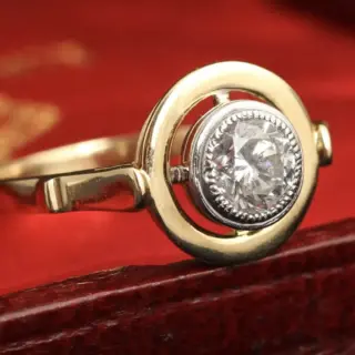 Ethically handmade Omphalos diamond solitaire ring by Erica Weiner, ~.50 ct old European cut diamond in milgrain edged white gold bezel and yellow gold halo.