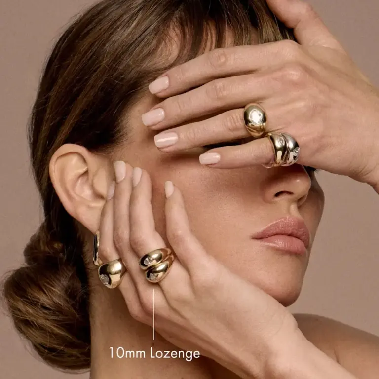 Side view of the Lozenge Dome Band Ring, highlighting its gently curved profile and seamless construction in 14k yellow gold