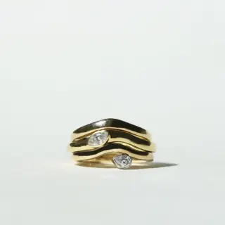 Grace Lee Pear Diamond Wave Band in 18K yellow gold with a pear-cut diamond set at the crest