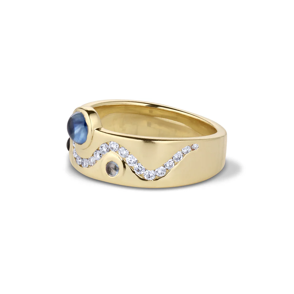 close-up of the White Diamond & Cabochon Sapphire Flux Ring, highlighting the intricate arrangement of the sapphires and diamonds within the 8.5mm wide band.