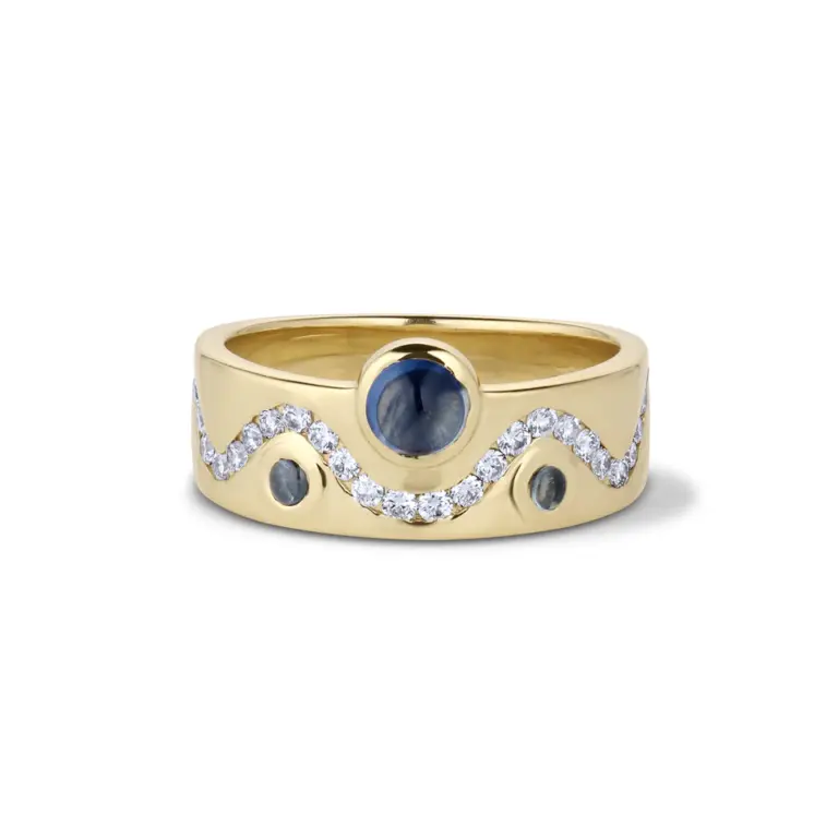Front view of Crevette Design Studio's White Diamond & Cabochon Sapphire Flux Ring, showcasing a .51ct sapphire cabochon centerstone flanked by .17ctw of Montana sapphire cabochons and .37ctw of white diamonds, all set in 14k solid gold.