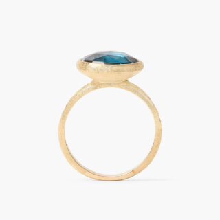 18K yellow gold ring with London blue topaz, hand-engraved Florentine finish.