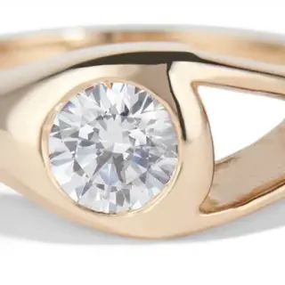 Minimalist Aira Diamond Ring: half-carat diamond set beside open void in reclaimed gold—Bario Neal