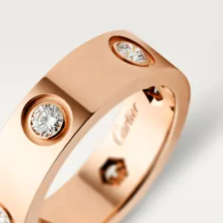 Side profile of the Cartier Love Ring, emphasizing the smooth band and diamond accents, representing enduring love.