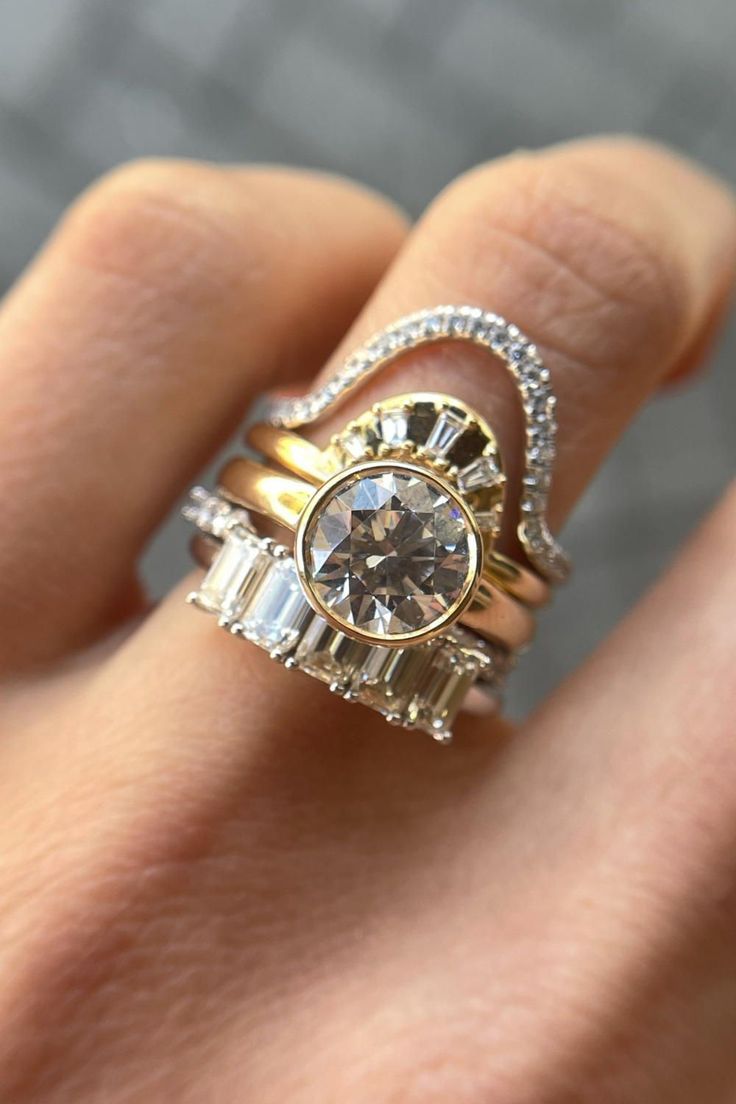 Close-up of the Tessa Bezel Round Solitaire Engagement Ring, highlighting the clean lines of the 14K yellow gold band and the brilliance of the 1.5ct diamond.