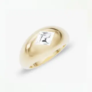 Close-up of VRAI’s Lozenge Dome Band Ring, showcasing the high-polish finish and contemporary silhouette in solid yellow gold.
