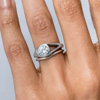 Side view of Aira Diamond Ring showing 0.50 ct diamond and adjacent open-space design