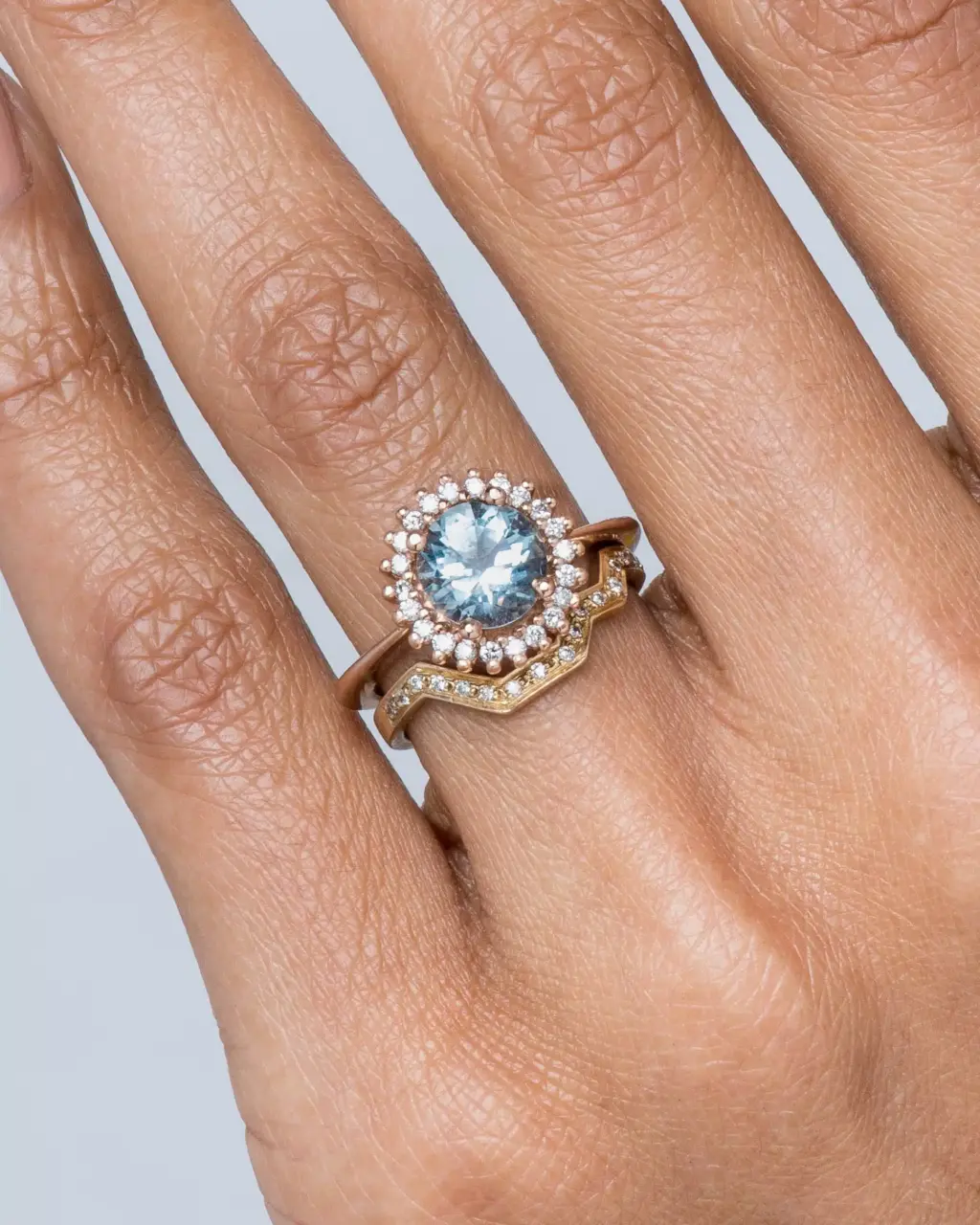Stellium Ring by Bario Neal – oval aquamarine center stone with ethical diamond halo in 14k gold