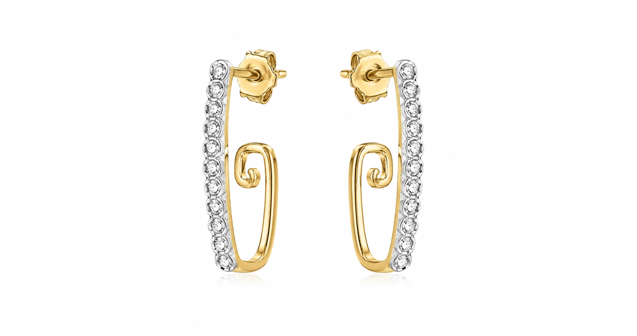 The finished gold and diamond earrings, made from the hand-drawn design