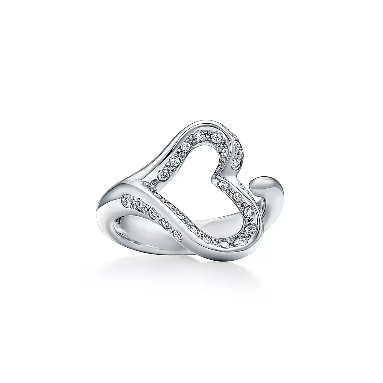 A direct offering from Tiffany, this version transforms the classic open-heart silhouette into luxurious warm-toned 18 k gold. It preserves the same iconic fluid shape but with a more upscale metal choice.