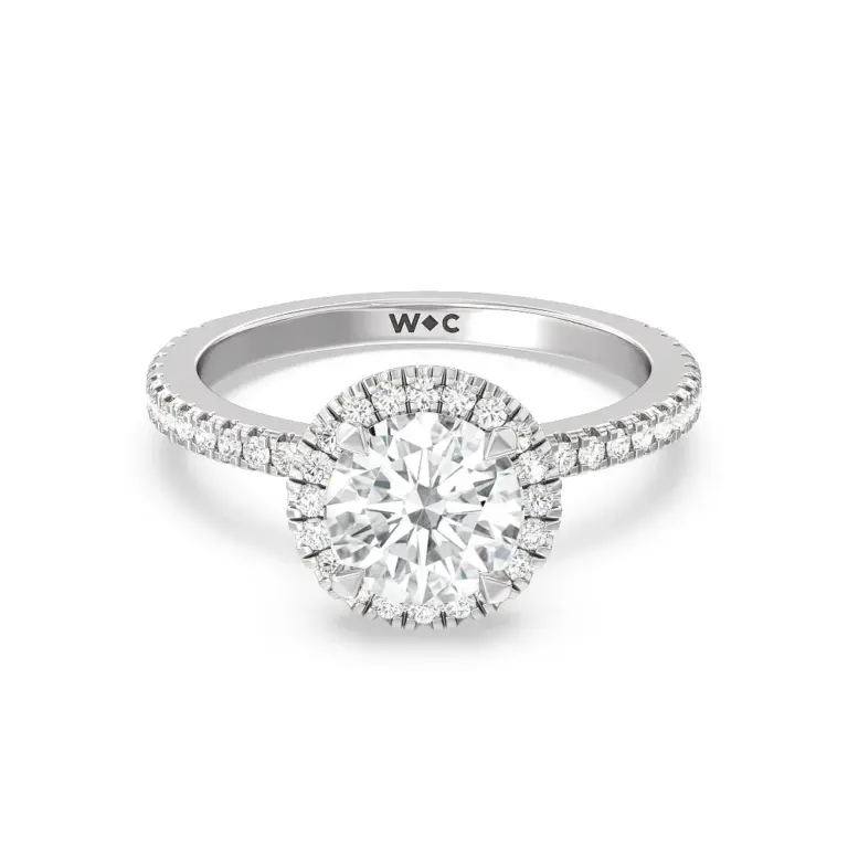 Close-up of lab-grown diamond halo ring showcasing pavé diamonds on the shank and brilliant IGI-certified center stone.