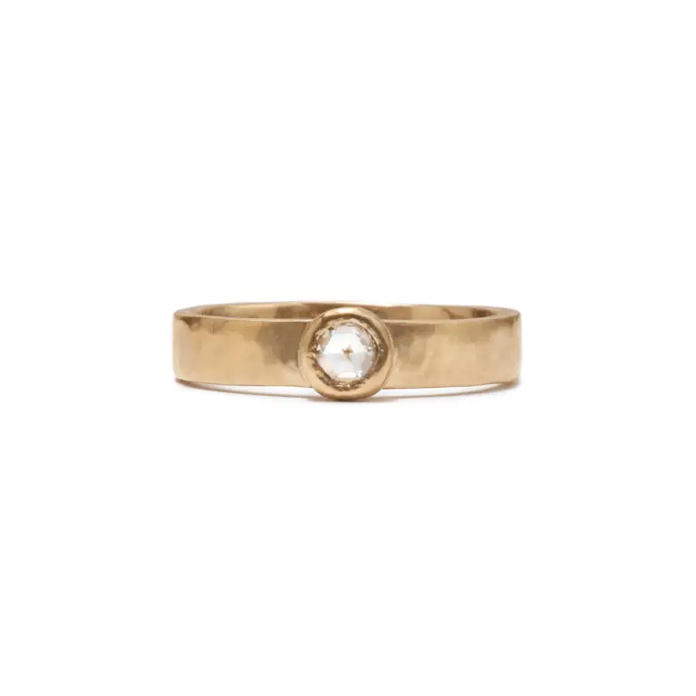 Natalie Diamond Solitaire Ring by Fail Jewelry, handcrafted in Austin, TX, featuring a 3.4mm round rose-cut white diamond (.09 tcw) bezel set in Fairmined® 14k yellow gold with a hammered texture band.