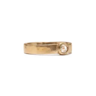 Fairmined® 14k yellow gold ring with 3.4mm round rose-cut white diamond and hammered texture band.