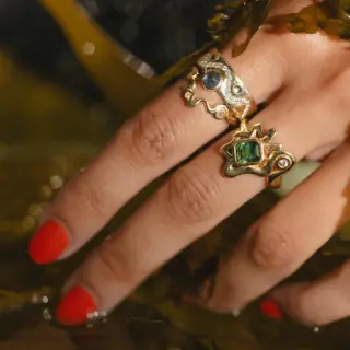 Side profile of the White Diamond & Cabochon Sapphire Flux Ring, emphasizing the smooth 14k yellow gold band and the seamless integration of the gemstones.