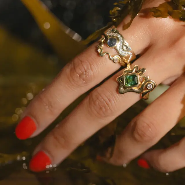 Side profile of the White Diamond & Cabochon Sapphire Flux Ring, emphasizing the smooth 14k yellow gold band and the seamless integration of the gemstones.