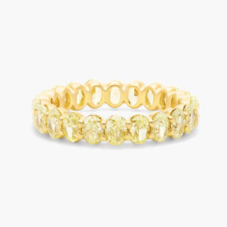 Elegant gold diamond eternity engagement ring featuring a continuous band of round brilliant-cut diamonds set in polished yellow gold.