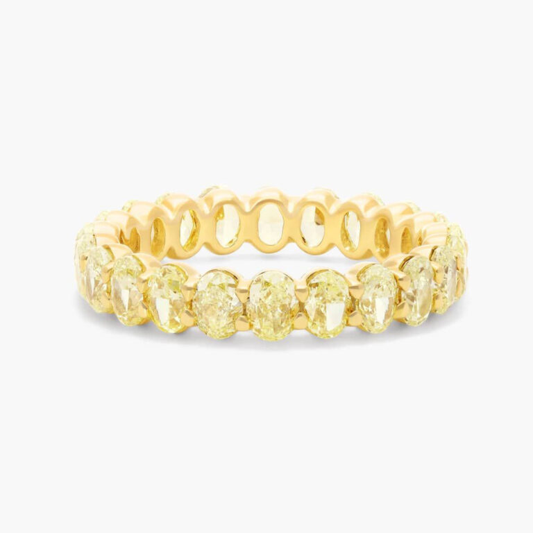 Elegant gold diamond eternity engagement ring featuring a continuous band of round brilliant-cut diamonds set in polished yellow gold.