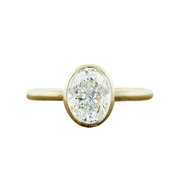 Katie Oval Bezel-Set Solitaire Engagement Ring with oval-cut diamond in a sleek bezel setting, crafted in 14k or 18k gold or platinum.