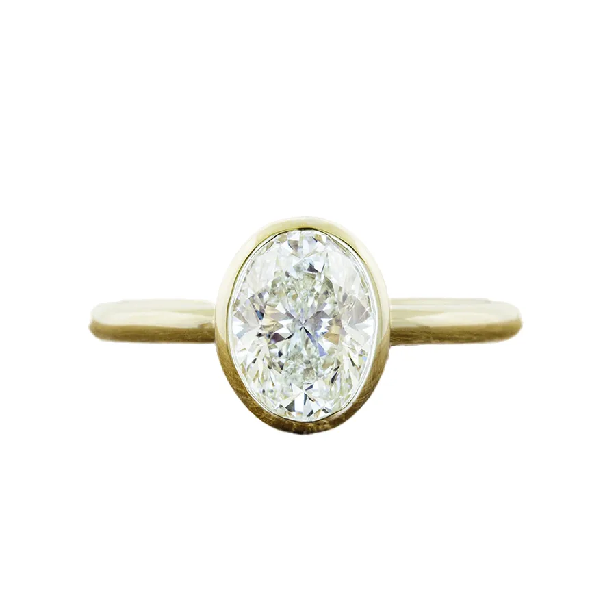 Katie Oval Bezel-Set Solitaire Engagement Ring with oval-cut diamond in a sleek bezel setting, crafted in 14k or 18k gold or platinum.