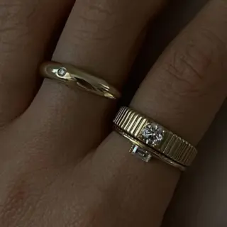 14k gold Solis ring featuring bezel-set round diamond and sculptural ribbed band