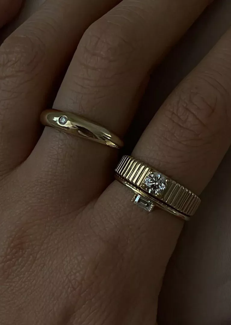 14k gold Solis ring featuring bezel-set round diamond and sculptural ribbed band