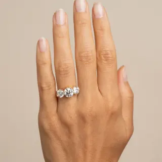 Elegant 3.22ct total weight engagement ring with round lab-grown diamonds in a classic three-stone setting, crafted in 14K yellow gold.