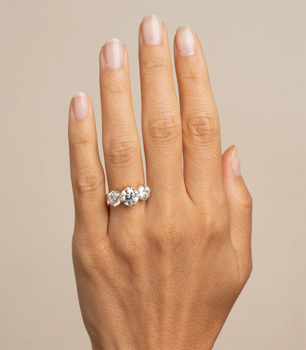 Elegant 3.22ct total weight engagement ring with round lab-grown diamonds in a classic three-stone setting, crafted in 14K yellow gold.