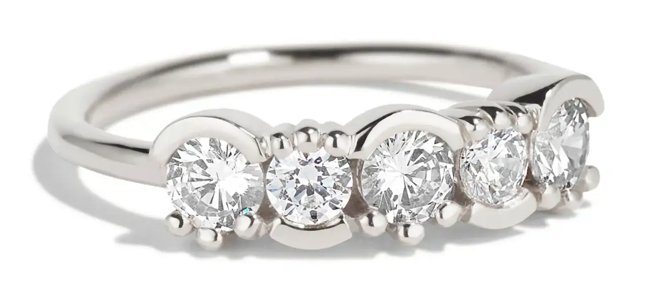 Close-up of Bario Neal’s Lash Linear Diamond Ring showing alternating 3 mm and 3.5 mm diamonds in half-bezel, half-prong settings