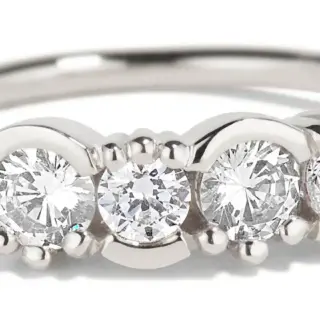 Close-up of Bario Neal’s Lash Linear Diamond Ring showing alternating 3 mm and 3.5 mm diamonds in half-bezel, half-prong settings