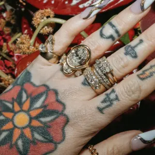 Marrow x Sammi Florence engagement ring in 14k gold with lab-grown oval diamond in a bezel and claw prong setting, accented by twisted serpentine gallery details.