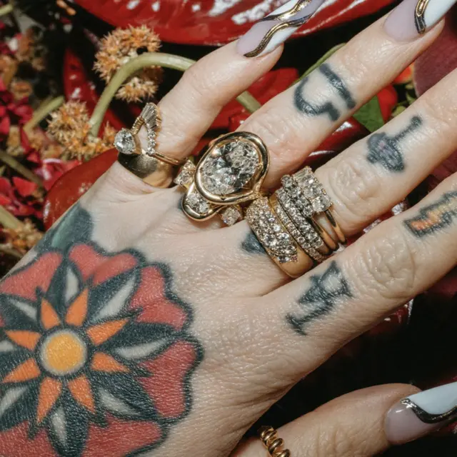 Marrow x Sammi Florence engagement ring in 14k gold with lab-grown oval diamond in a bezel and claw prong setting, accented by twisted serpentine gallery details.