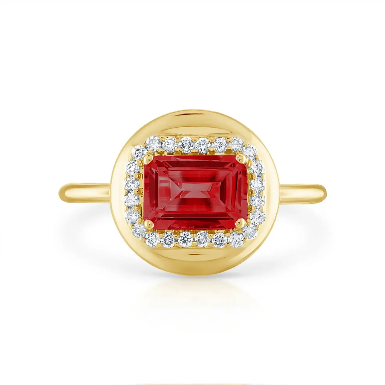 Close-up of Stephanie Gottlieb's Mini Candy Button Ring showcasing a polished 14K yellow gold band with a bold emerald gemstone and diamond accents