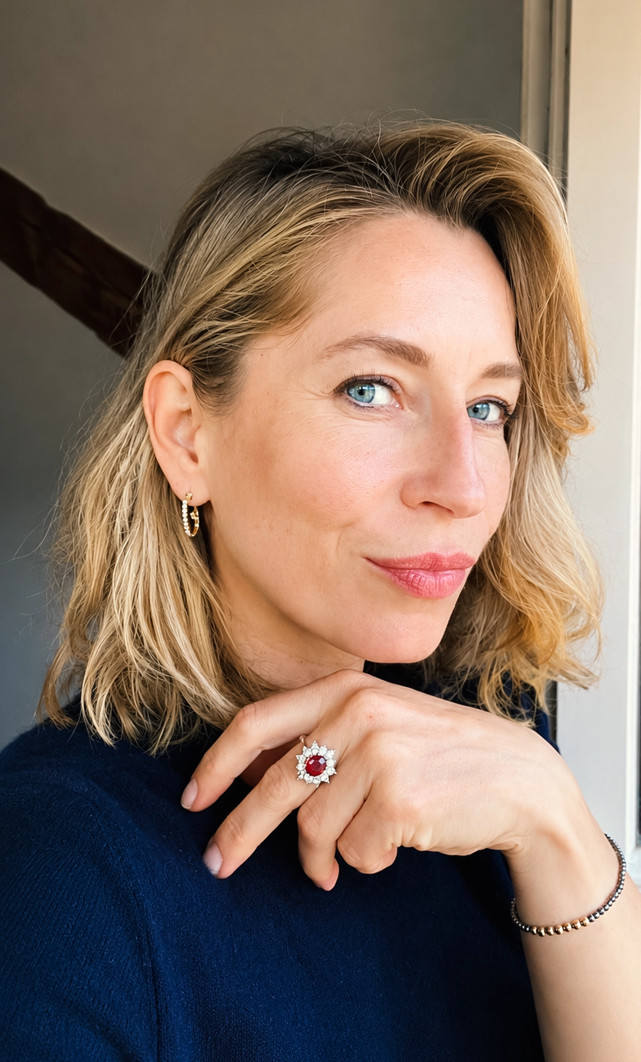 Skai, founder of willyoulove.me, wearing the earrings twenty years later