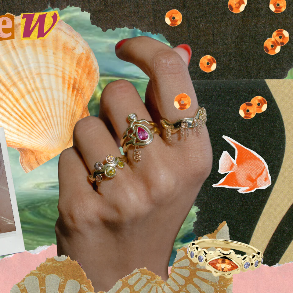 The Cadlina wavy ring with five cushion-cut Montana kaleidoscope sapphires in varying blue-green hues, set in 14K yellow gold, showcased head-on.