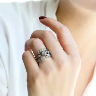 Side view of the Cathy Waterman ring, highlighting the tapered recycled platinum band and leaf motifs.
