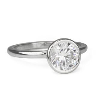 Mark Patterson platinum ring featuring a high-polish bezel and band with an open-sided bezel design to showcase your diamond from all angles