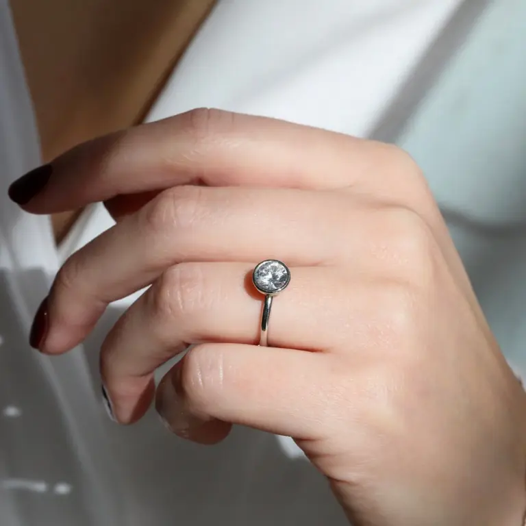 Elegant platinum open-sided bezel ring mount by Mark Patterson, designed to highlight the center stone's brilliance