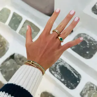 Audrey Nicole Diamonds oval emerald cut diamond ring with sculptural dome gold setting