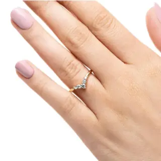 Angled close-up of the 14K yellow gold Diamond V Wedding Band, highlighting the band’s curvature and the varying sizes of round lab-grown diamonds.