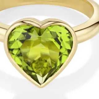 Statement peridot heart ring in yellow gold bezel setting – bold birthstone piece