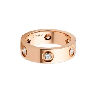Front view of Cartier Love Ring in rose gold, set with 6 brilliant-cut diamonds totaling 0.46 carat, showcasing its iconic screw motif.