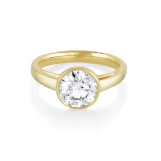 Front view of Marrow Fine's Tessa Bezel Round Solitaire Engagement Ring in 14K yellow gold, showcasing a 1.5ct round brilliant-cut diamond set in a sleek bezel setting.