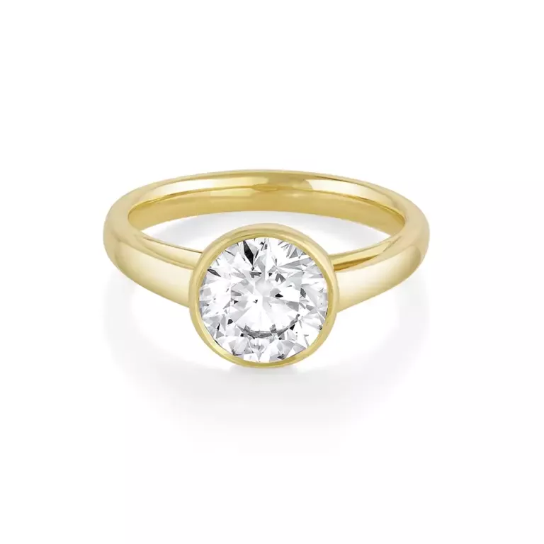 Front view of Marrow Fine's Tessa Bezel Round Solitaire Engagement Ring in 14K yellow gold, showcasing a 1.5ct round brilliant-cut diamond set in a sleek bezel setting.