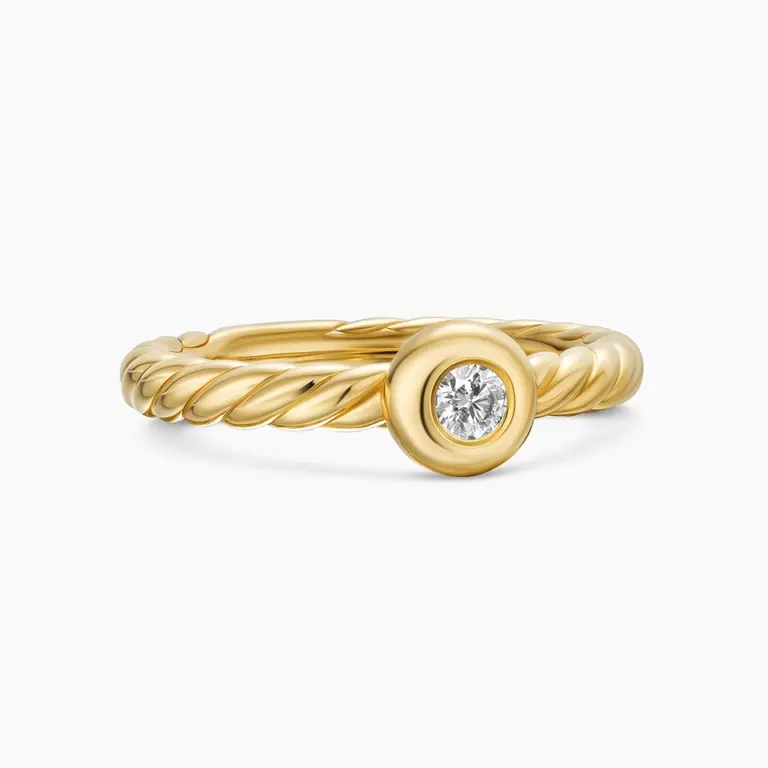 Front view of David Yurman's Petite Cable Ring in 18K yellow gold, featuring a 2.8mm center diamond set within the signature twisted cable band.